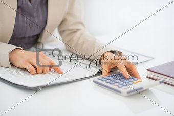 Closeup on business woman working with documents
