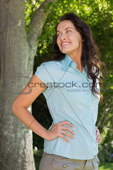 Woman looking over shoulder in park