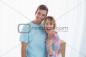Happy couple holding new house key