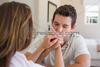 Woman consoling a sad young man
