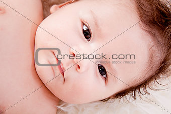 cute little baby infant toddler on white blanket portrait
