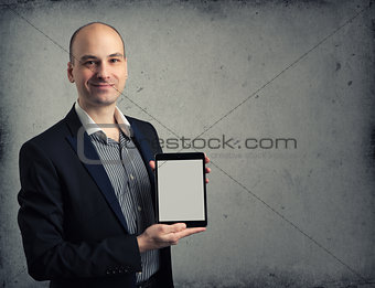 Business man holding digital tablet PC with blank screen