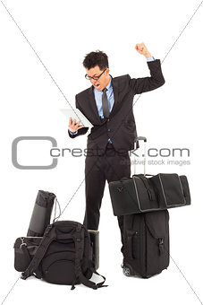 Angry businessman make a fist  and holding a tablet 