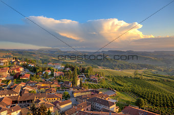 Small italian town on the hills at sunset.