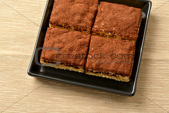 Tiramisu cake with cocoa; selective focus.