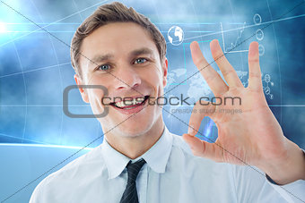 Composite image of businessman showing ok sign