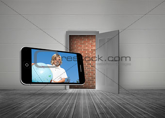 Composite image of blonde happy boy on smartphone screen