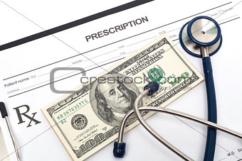 Prescription with money and stethoscope