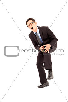 businessman have  the knee pain and painful expression