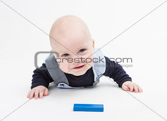 interested baby with toy block