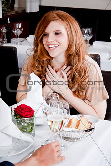 happy smiling couple in restaurant celebrating