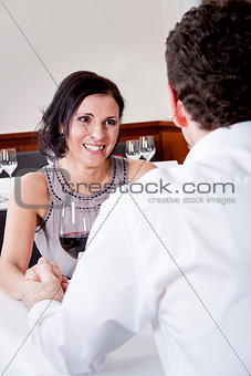 happy smiling couple in restaurant 