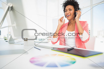Casual female photo editor using computer