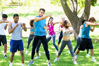 Friends exercising in park