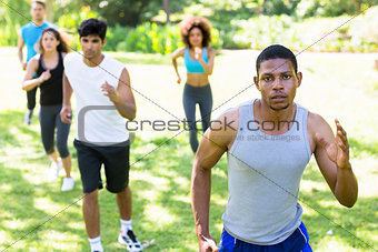 People running for fitness in the park