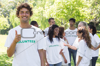 Confident volunteer showing thumbs up