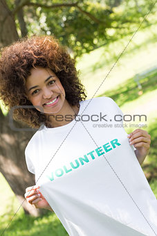 Environmentalist holding volunteer tshirt
