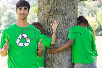 Environmentalist gesturing thumbs up in park