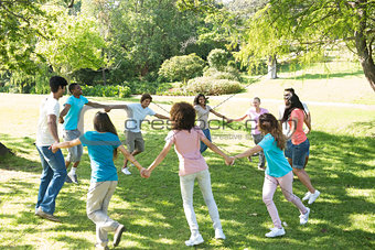 Friends walking in a circle at park