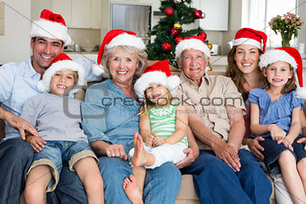 Family in Santa hats celebrating Christmas