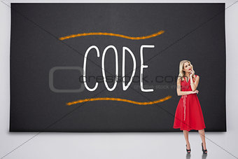 Pretty blonde thinking against the word code