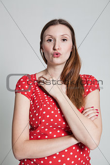 Attractive woman blowing kiss