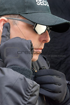 Close Protection Listens To Earpiece