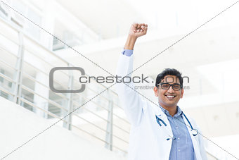 Asian Indian male medical doctor celebrating success