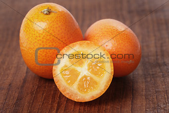 fresh kumquat on wood table
