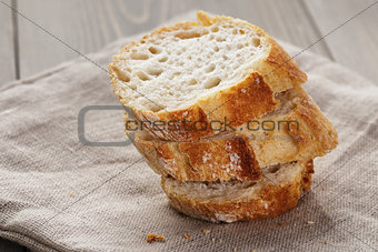 slices of fresh french baguette on table