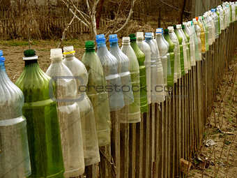 garden fence with plastic bottles 
