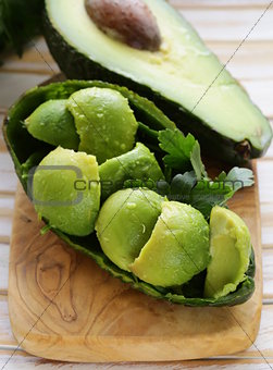 salad of fresh avocado on a wooden board