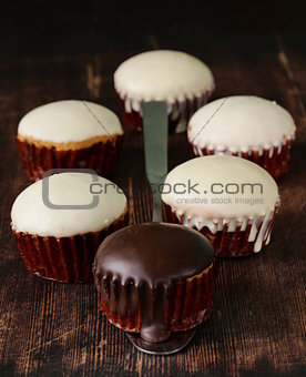 sweet cupcakes with chocolate icing white and black