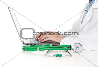 medical worker typing on laptop