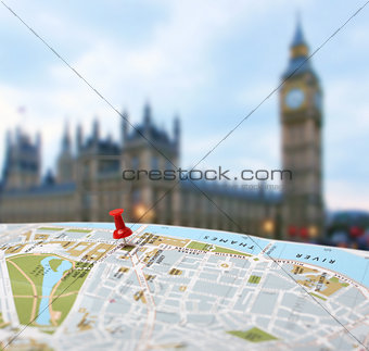 Travel destination London map push pin blur