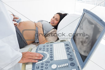 Doctor operating ultrasound machine