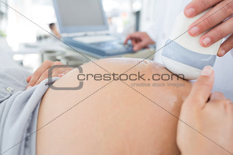 Pregnant woman receiving ultrasound