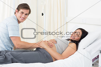 Happy expectant couple in hospital