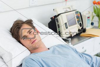 Patient relaxing in hospital bed