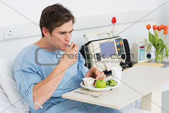 Man having healthy food in hospital