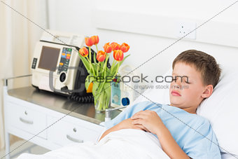 Boy resting in hospital bed