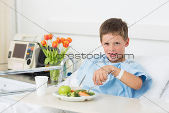 Boy having healthy food in hospital