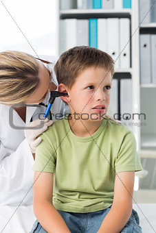 Boy being examined by female doctor