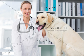 Confident female vet with dog