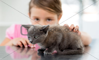 Girl with kitten at veterinary office