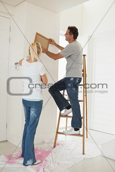 Couple decorating their new house