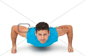 Portrait of a determined man doing push ups