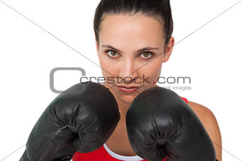 Close-up portrait of a determined female boxer