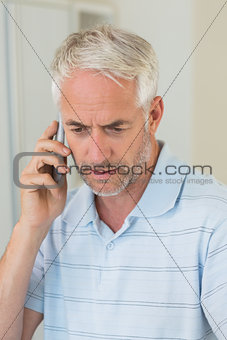Serious man on a phone call