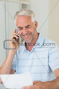 Smiling man on a phone call
